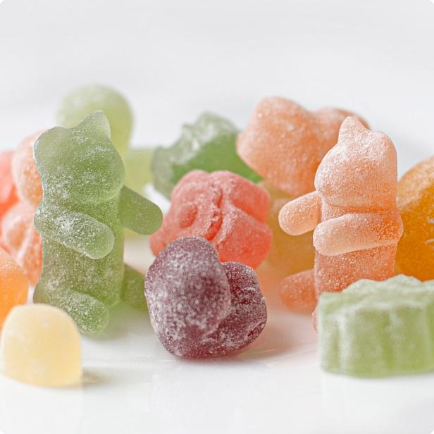 Brightly coloured gummy candies displayed on a light background.