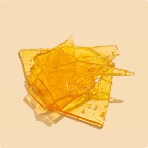 Small pieces of bright yellow cannabis concentrate.